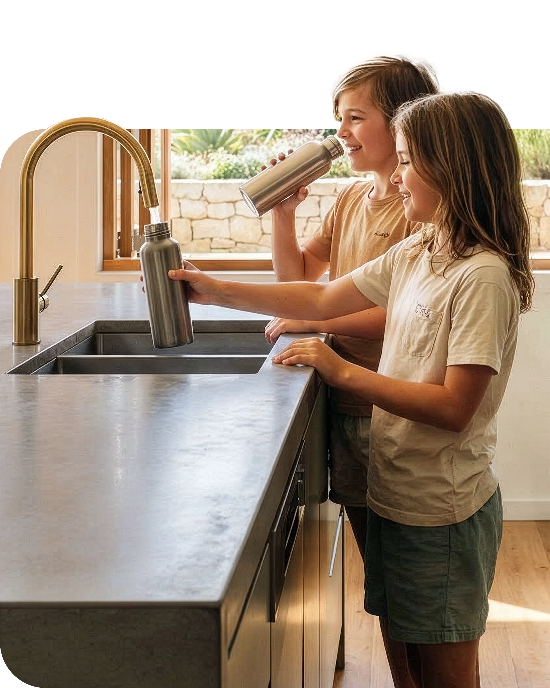 Two children holding glasses under a running tap to get drinking water.