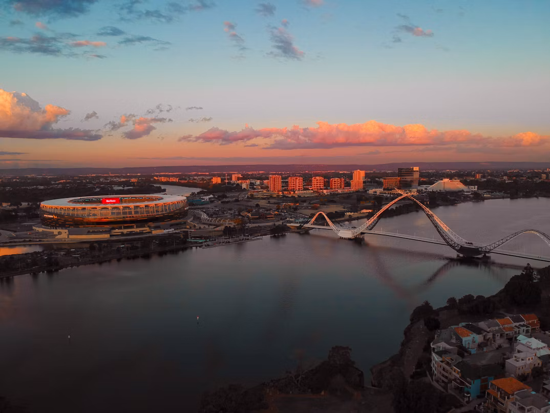 A shot of Optus Stadium and Matagarup Bridge at sunset. 
