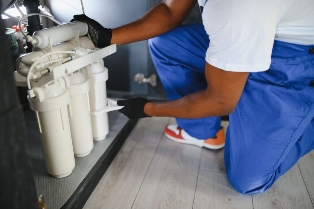 Technician working on a water filtration system.